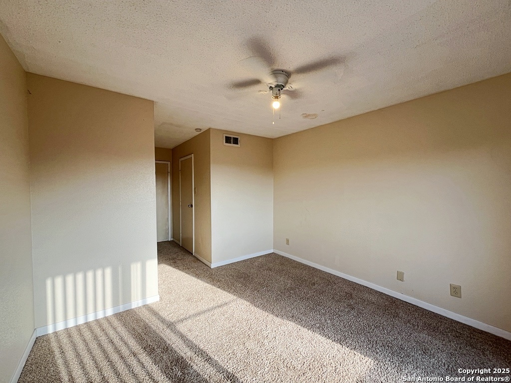 3243 Nacogdoches Road, Unit 404 San Antonio, TX 78217 - Photo 19 of 30 a big room with wooden floor chandelier fan and windows