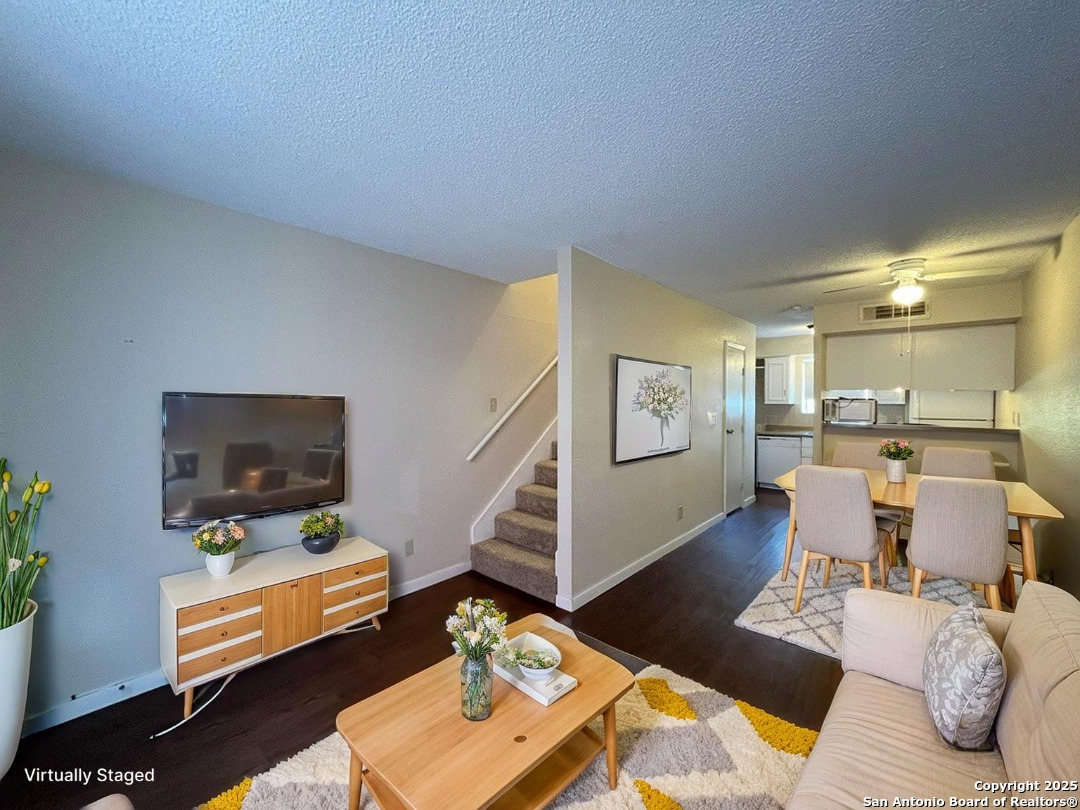 3243 Nacogdoches Road, Unit 404 San Antonio, TX 78217 - Photo 2 of 30 a living room with furniture and a flat screen tv