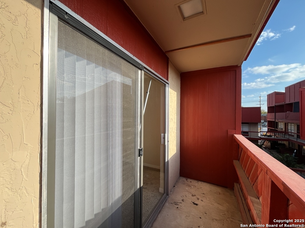 3243 Nacogdoches Road, Unit 404 San Antonio, TX 78217 - Photo 24 of 30 a kitchen with stainless steel appliances granite countertop a refrigerator and a stove