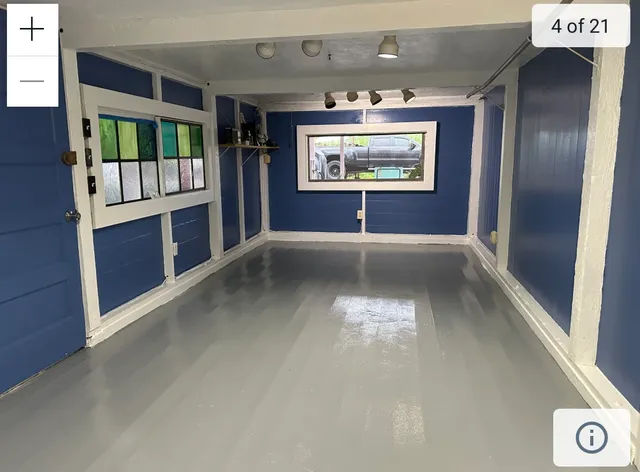 a view of an empty room with a window