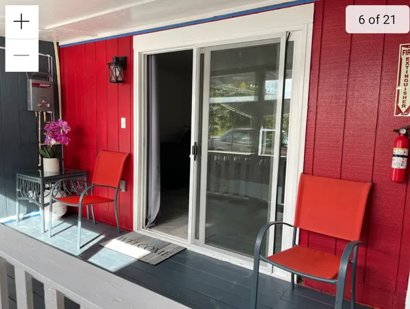 a balcony view with furniture and wooden floor