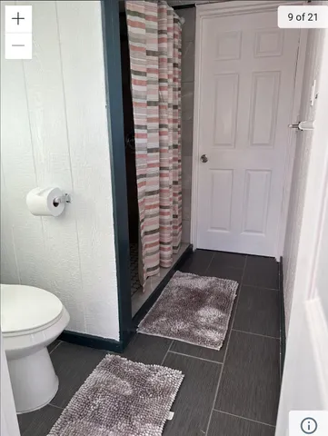 a bedroom with bed and a window