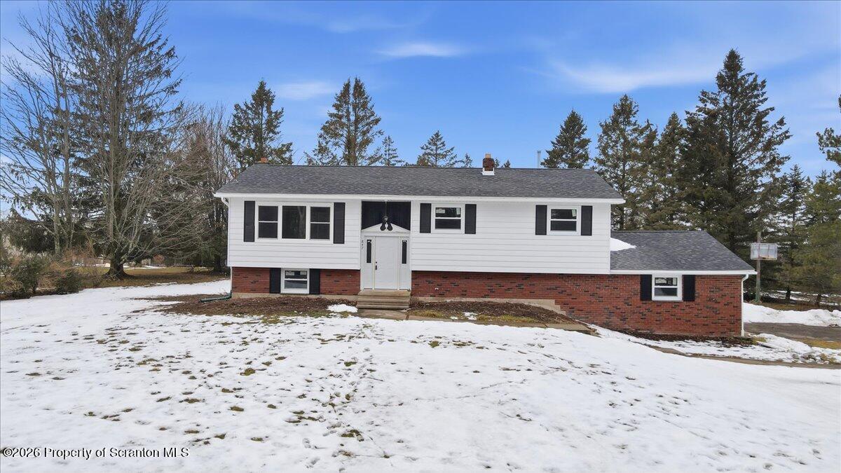 847 Griffin Pond Road Clarks Summit, PA 18411 - Photo 2 of 57 a view of a house with a yard covered in snow