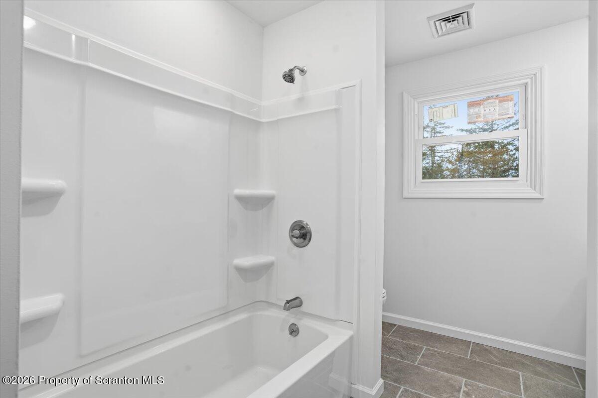 847 Griffin Pond Road Clarks Summit, PA 18411 - Photo 25 of 57 a bathroom with a bathtub