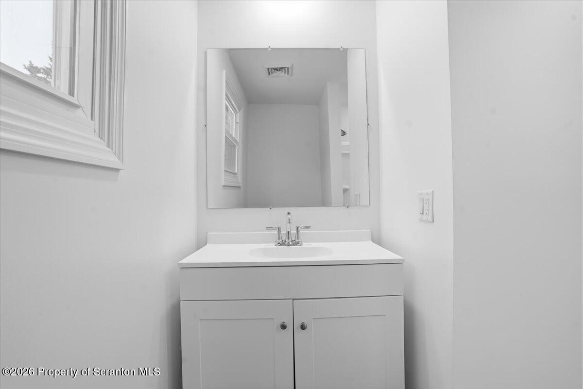 847 Griffin Pond Road Clarks Summit, PA 18411 - Photo 26 of 57 a bathroom with a sink and a mirror