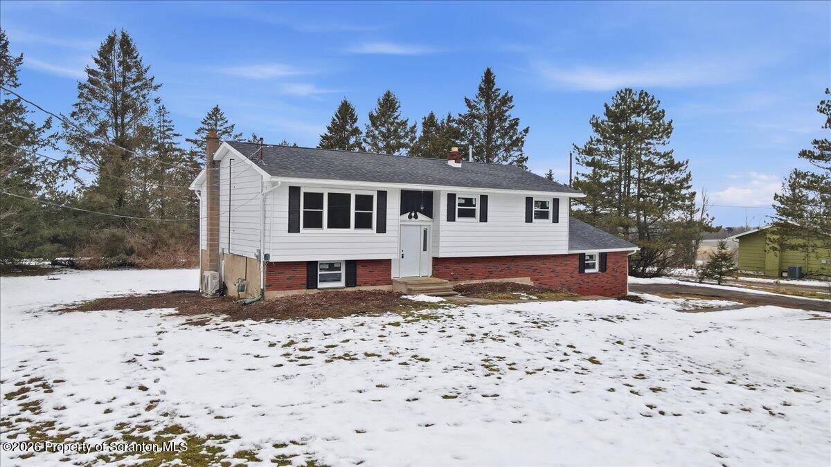 847 Griffin Pond Road Clarks Summit, PA 18411 - Photo 3 of 57 a front view of a house with a yard