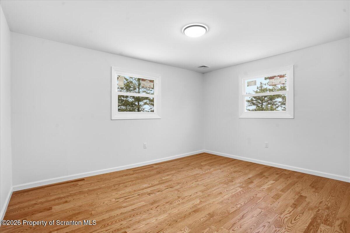 847 Griffin Pond Road Clarks Summit, PA 18411 - Photo 31 of 57 an empty room with a painting on the wall
