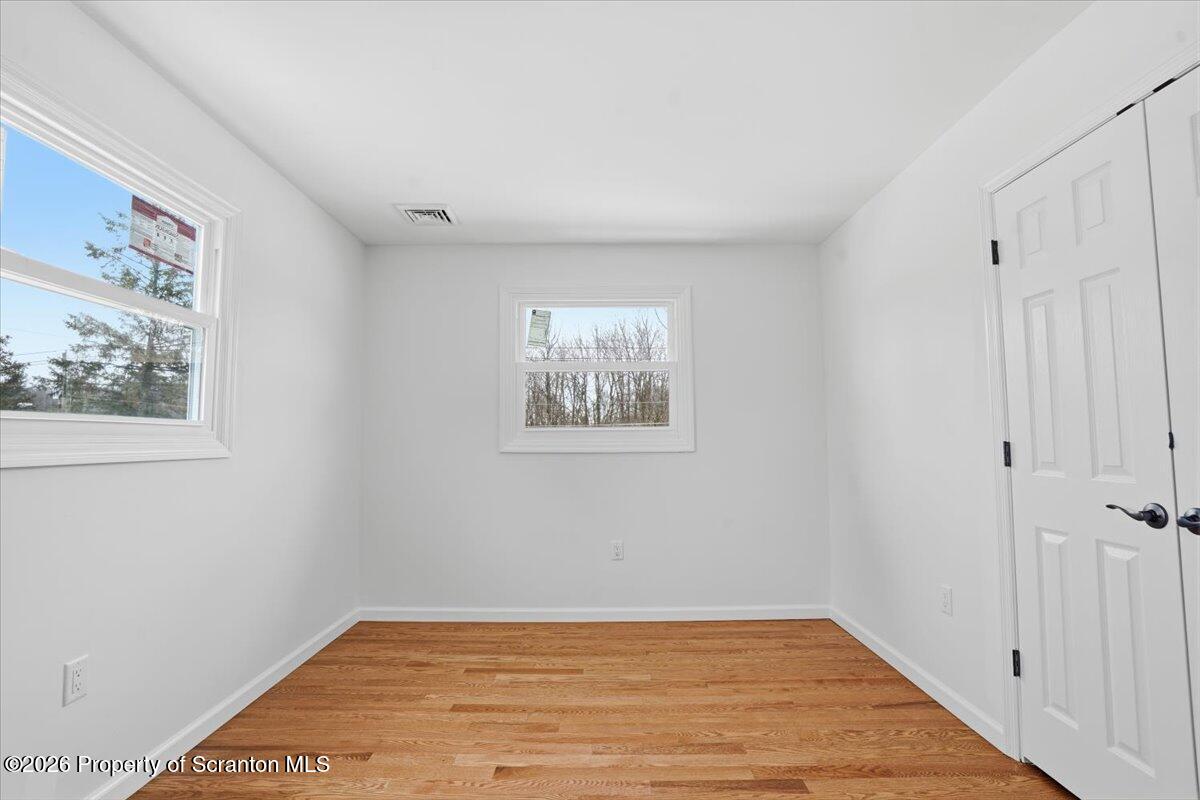 847 Griffin Pond Road Clarks Summit, PA 18411 - Photo 35 of 57 a view of a room with wooden floor and white walls