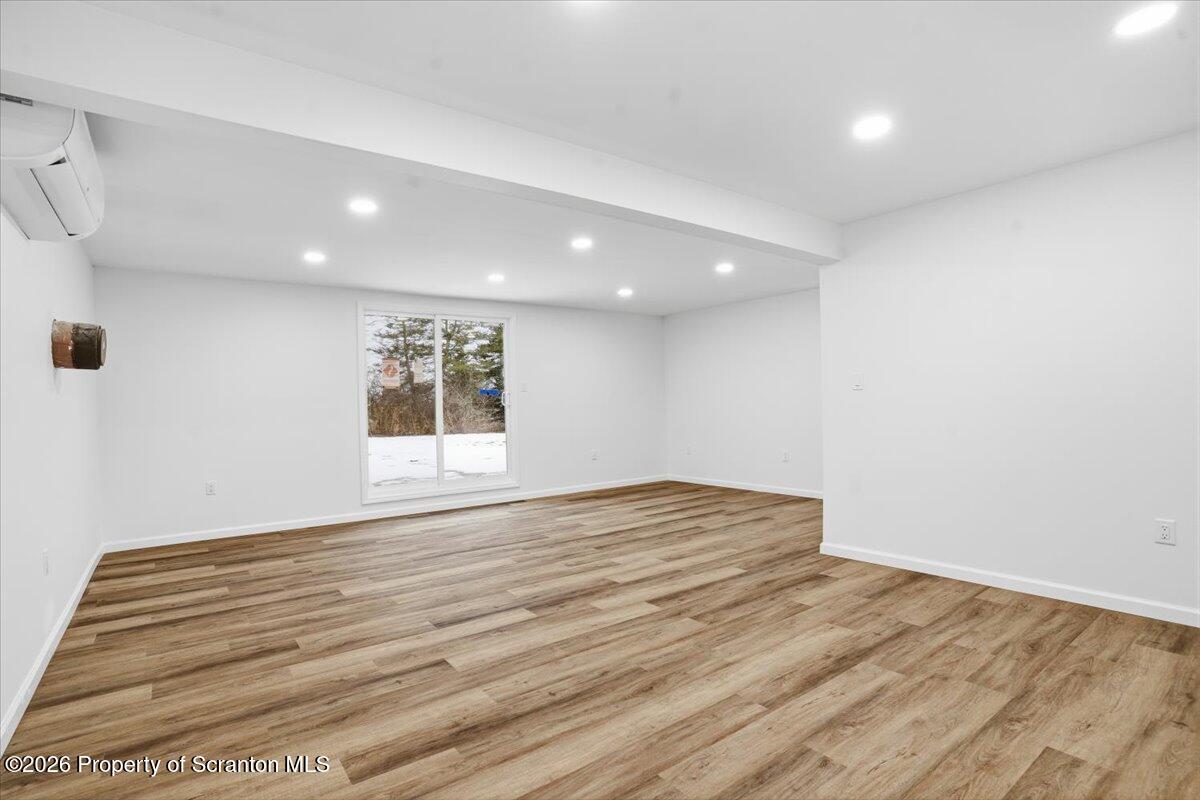 847 Griffin Pond Road Clarks Summit, PA 18411 - Photo 38 of 57 a view of empty room with wooden floor and fan