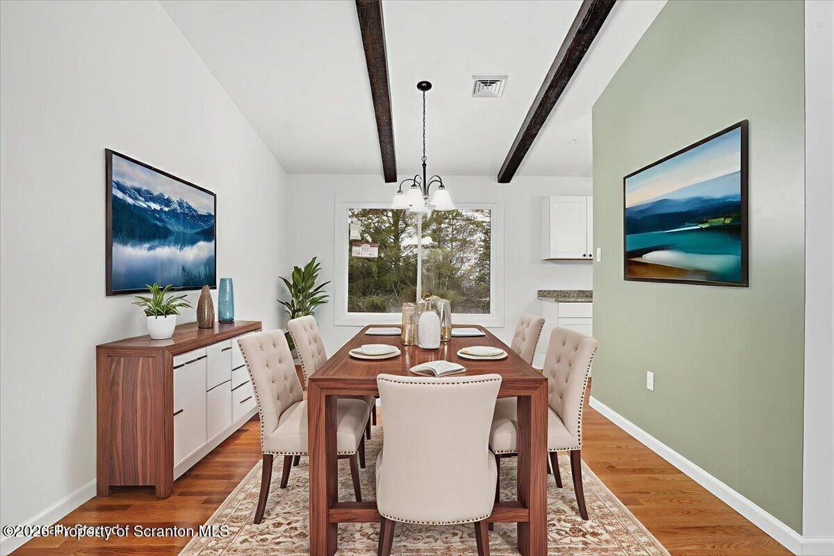 847 Griffin Pond Road Clarks Summit, PA 18411 - Photo 53 of 57 a dining room with furniture window and wooden floor