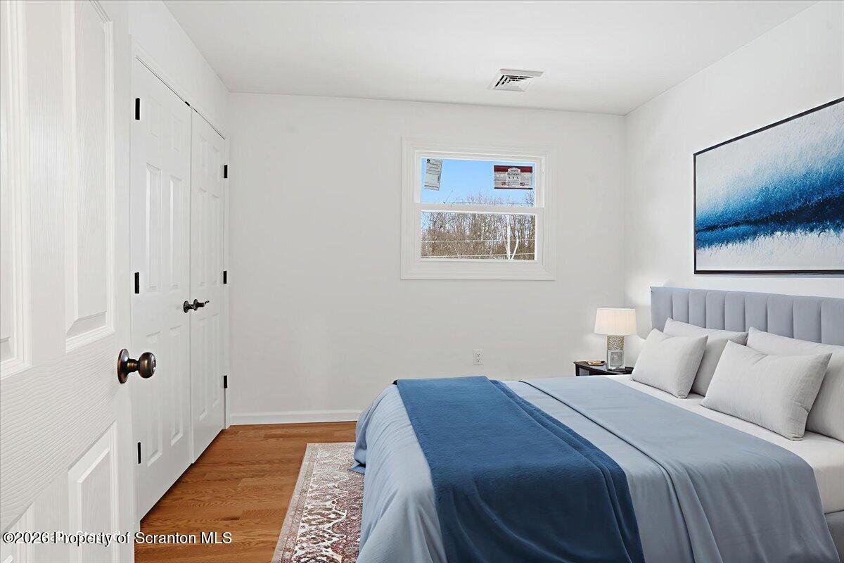 847 Griffin Pond Road Clarks Summit, PA 18411 - Photo 54 of 57 a bedroom with a bed and a window