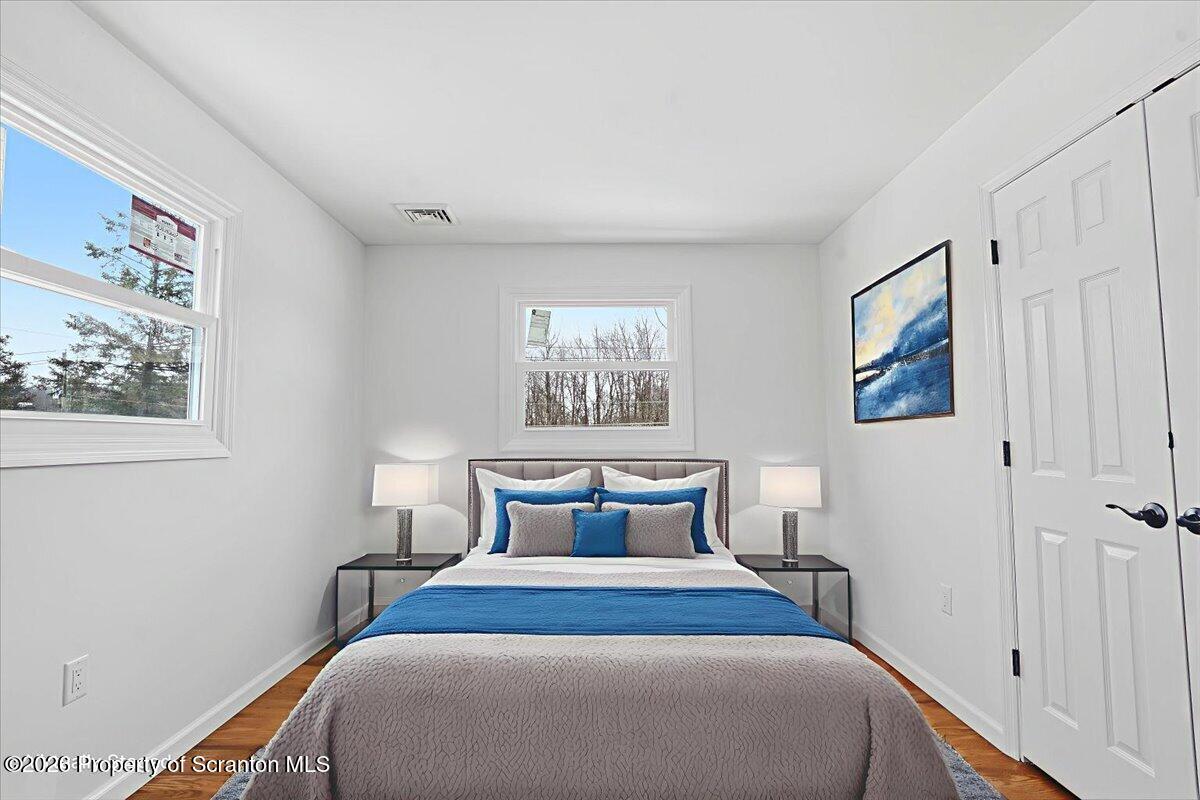 847 Griffin Pond Road Clarks Summit, PA 18411 - Photo 56 of 57 a bedroom with a bed and a window