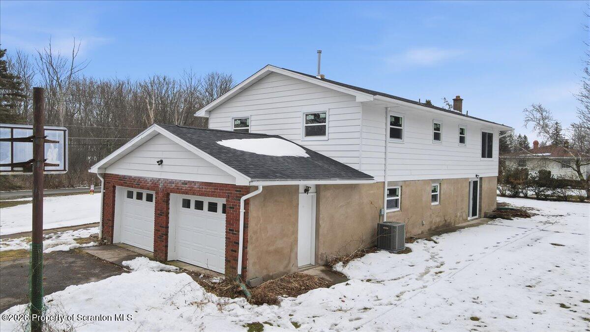 847 Griffin Pond Road Clarks Summit, PA 18411 - Photo 7 of 57 a view of a house with snow on the road