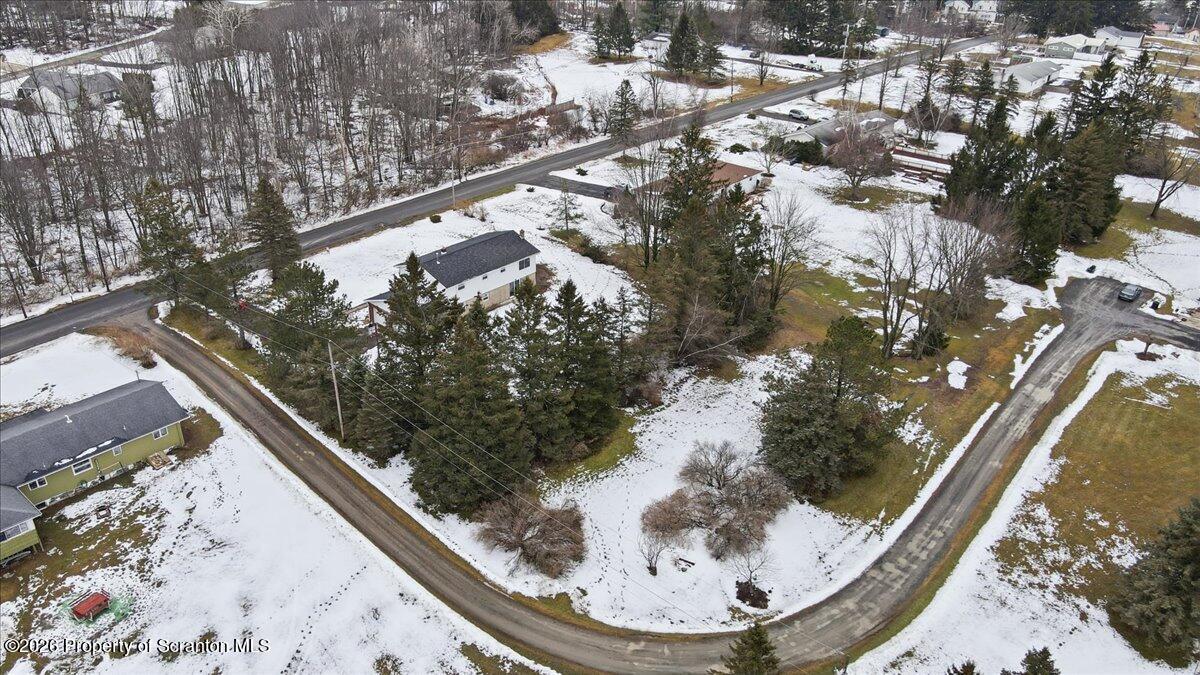 847 Griffin Pond Road Clarks Summit, PA 18411 - Photo 9 of 57 a view of swimming pool from a balcony