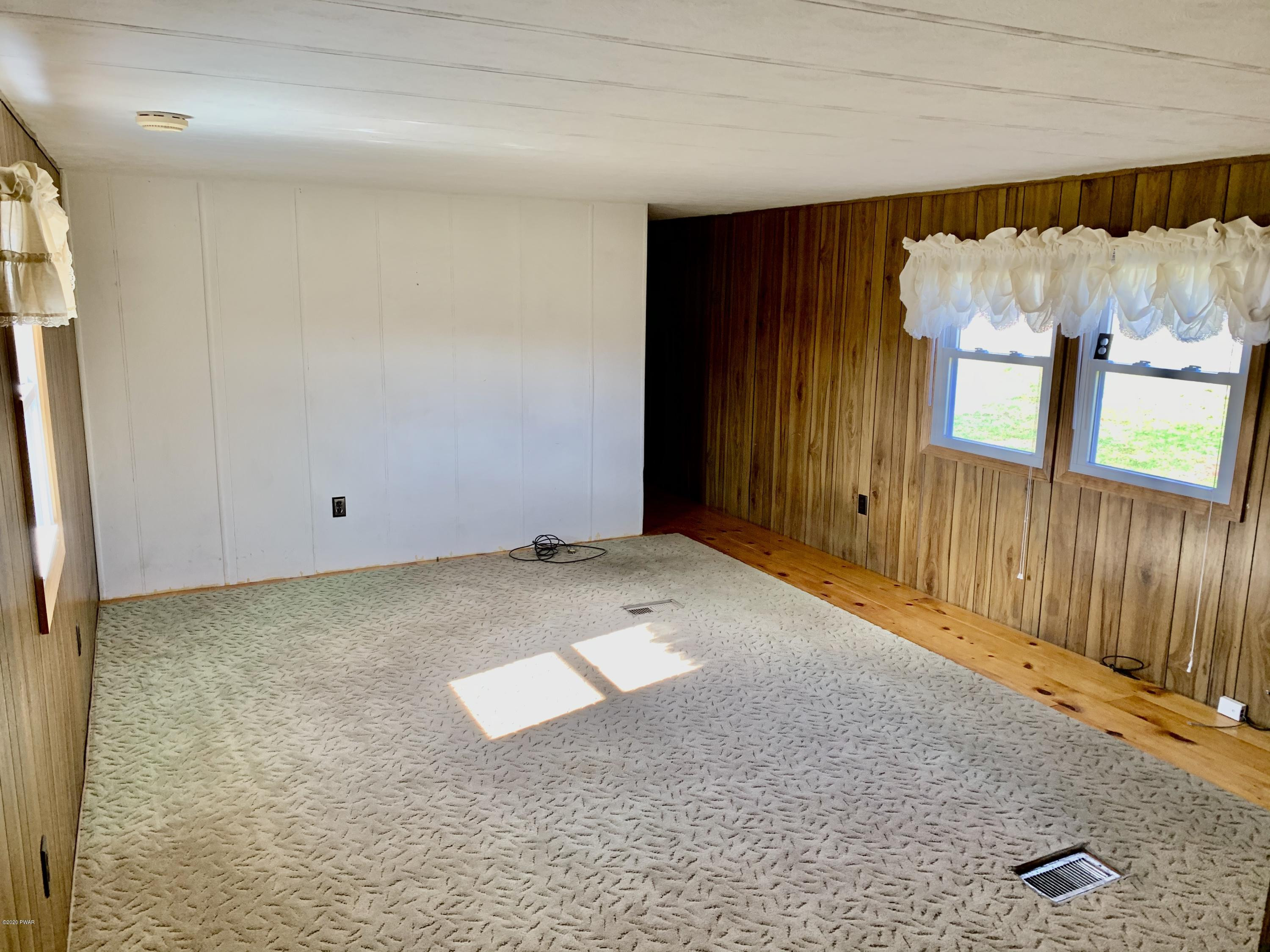 99 Slater Road Beach Lake, PA 18405 - Photo 17 of 35 an empty room with a window