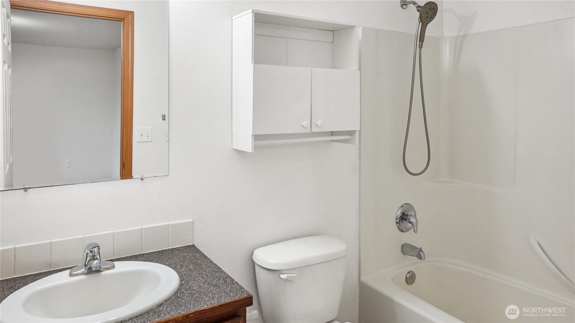 940 Capstone Avenue Othello, WA 99344 - Photo 14 of 25 a bathroom with a sink a toilet and shower