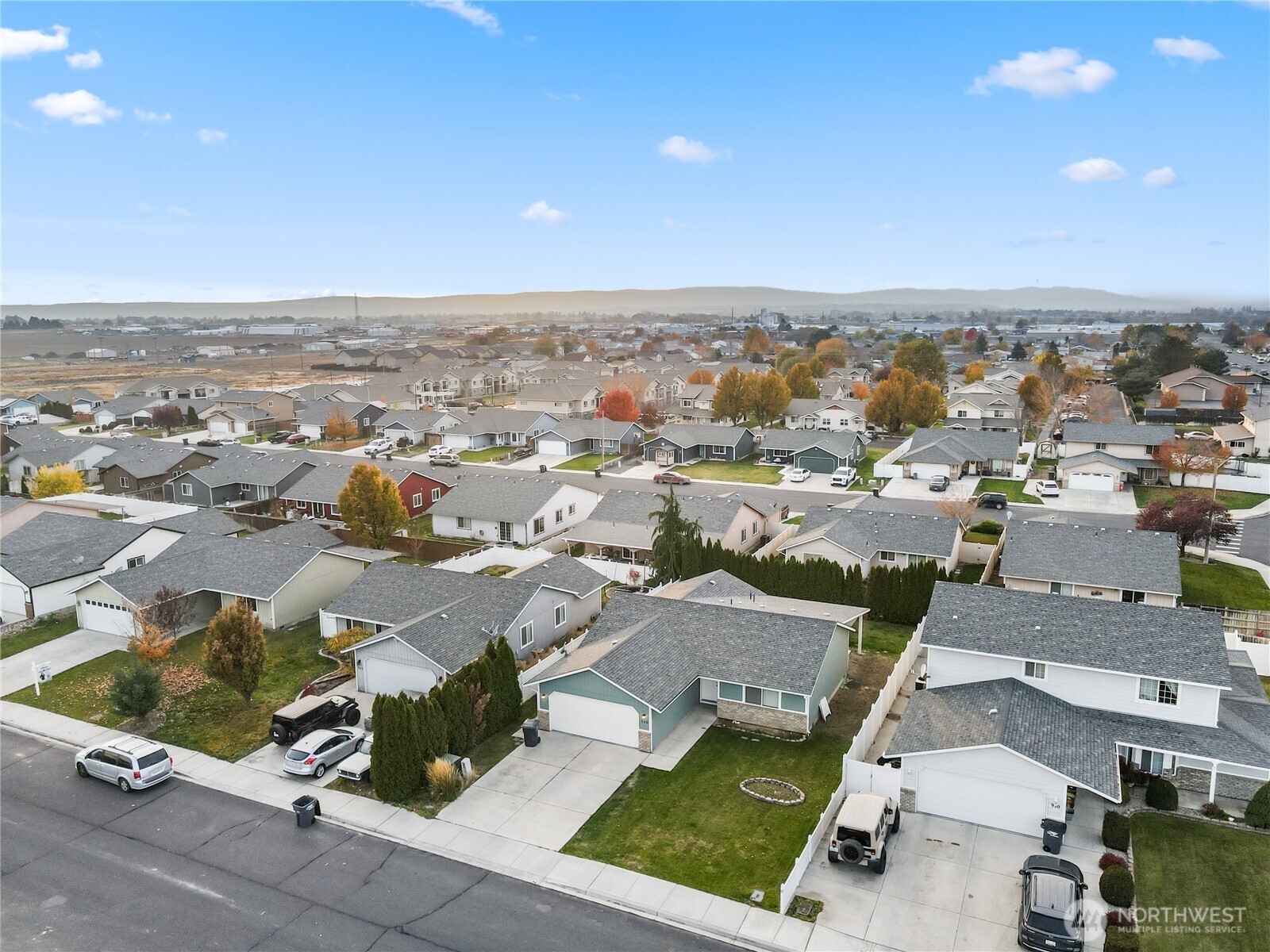 940 Capstone Avenue Othello, WA 99344 - Photo 24 of 25 an aerial view of residential houses with outdoor space