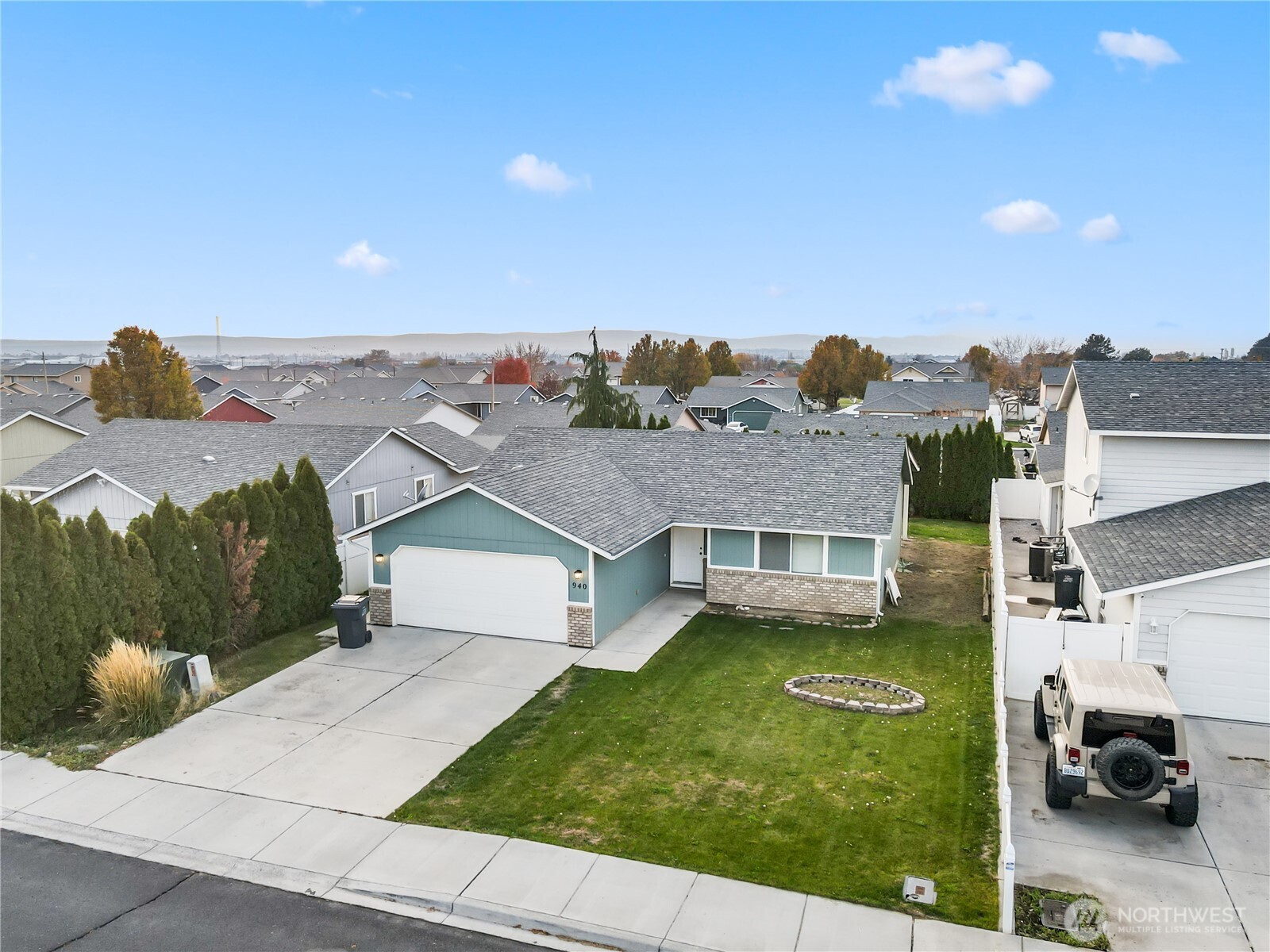 940 Capstone Avenue Othello, WA 99344 - Photo 5 of 25 a aerial view of a house with a garden
