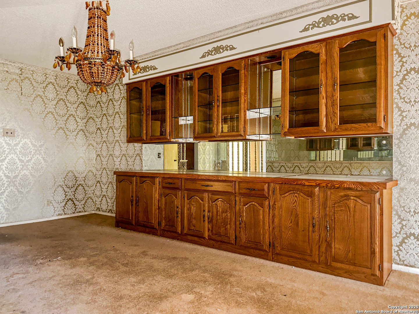 9107 Old Mill Road San Antonio, TX 78230 - Photo 3 of 14 a bathroom with a granite countertop sink and a large mirror