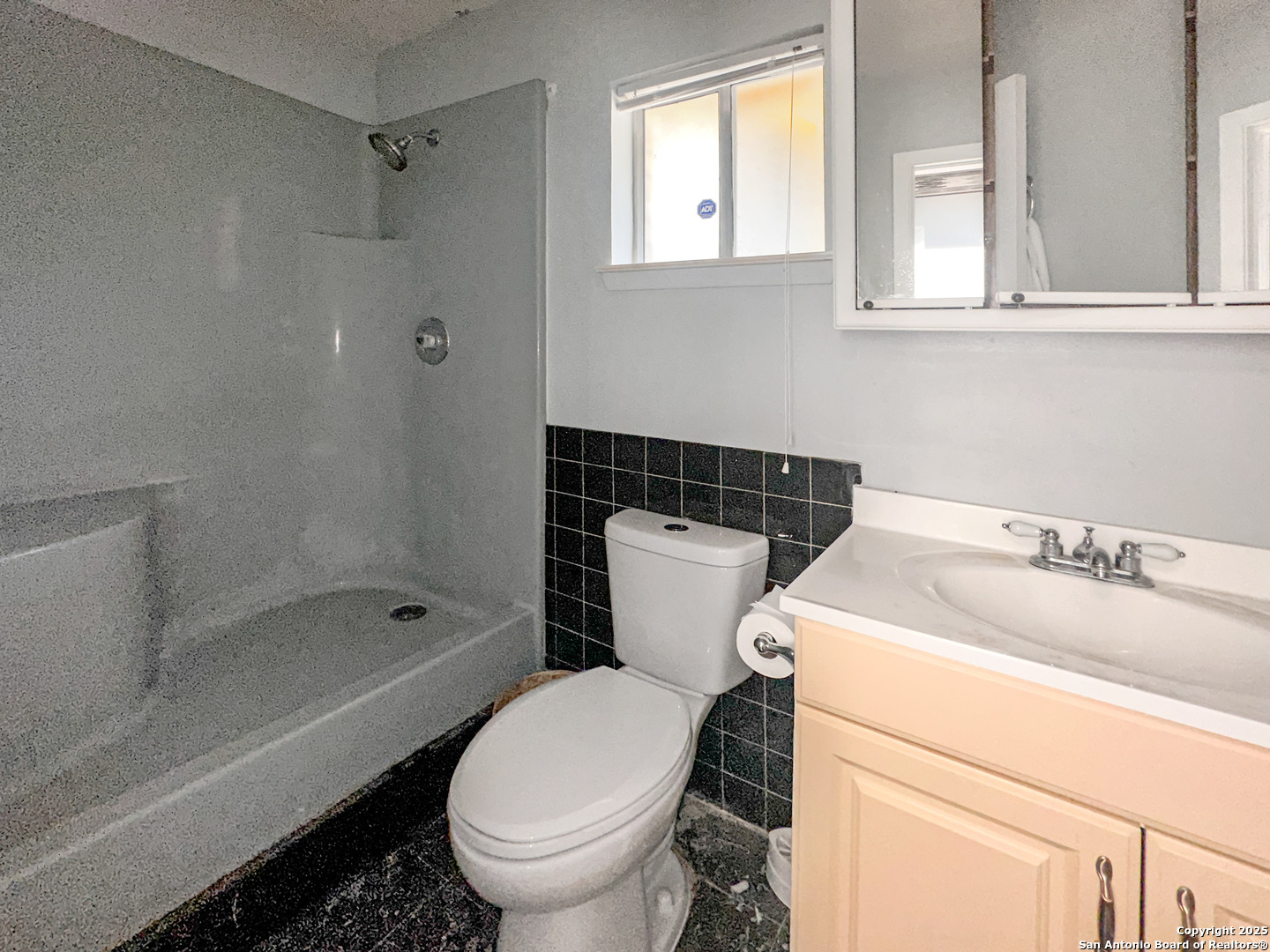 9107 Old Mill Road San Antonio, TX 78230 - Photo 8 of 14 a bathroom with a sink toilet and shower