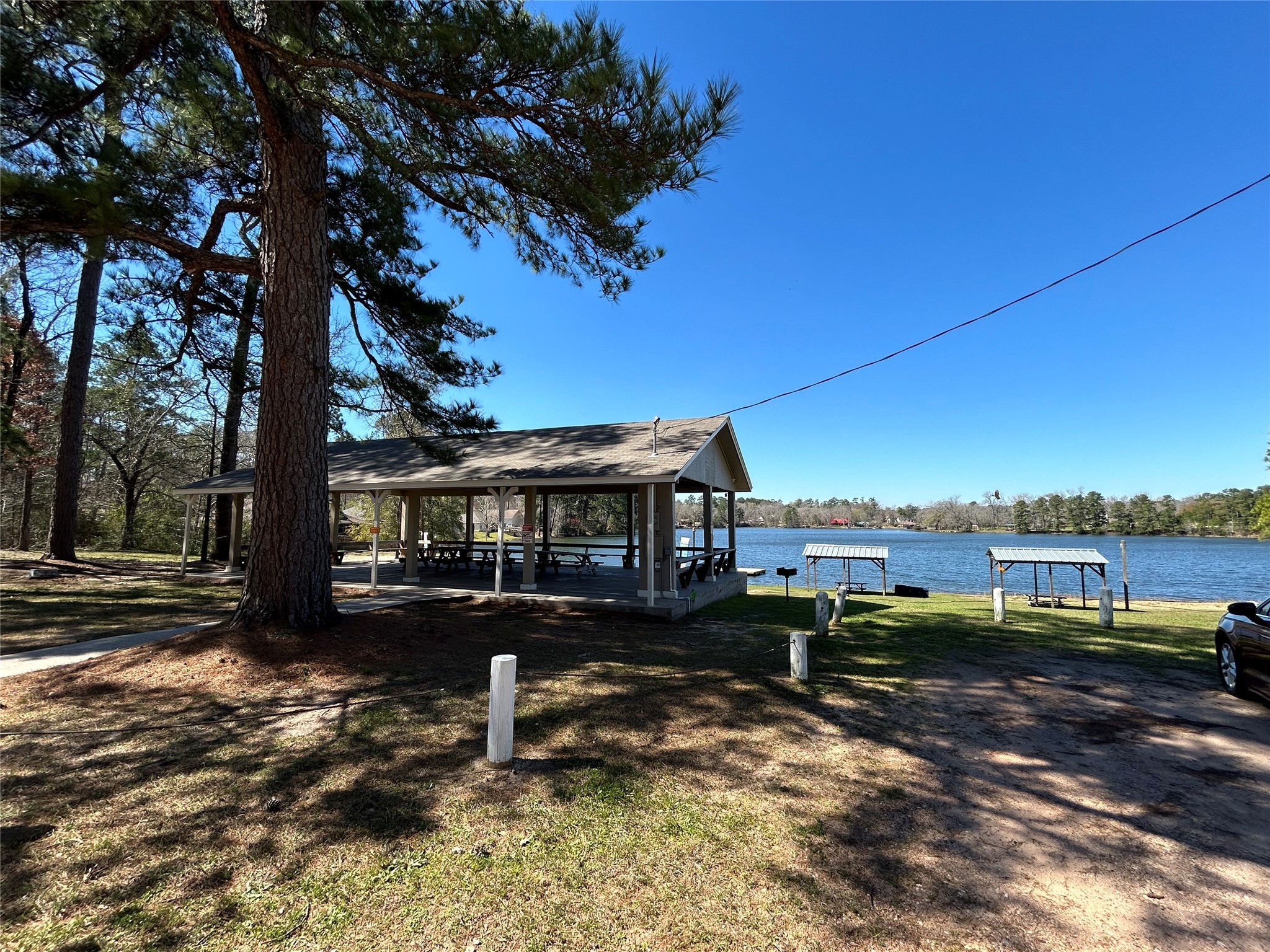 0 Royal Creek Road Conroe, TX 77303 - Photo 12 of 26 a view of a lake with a house in the background