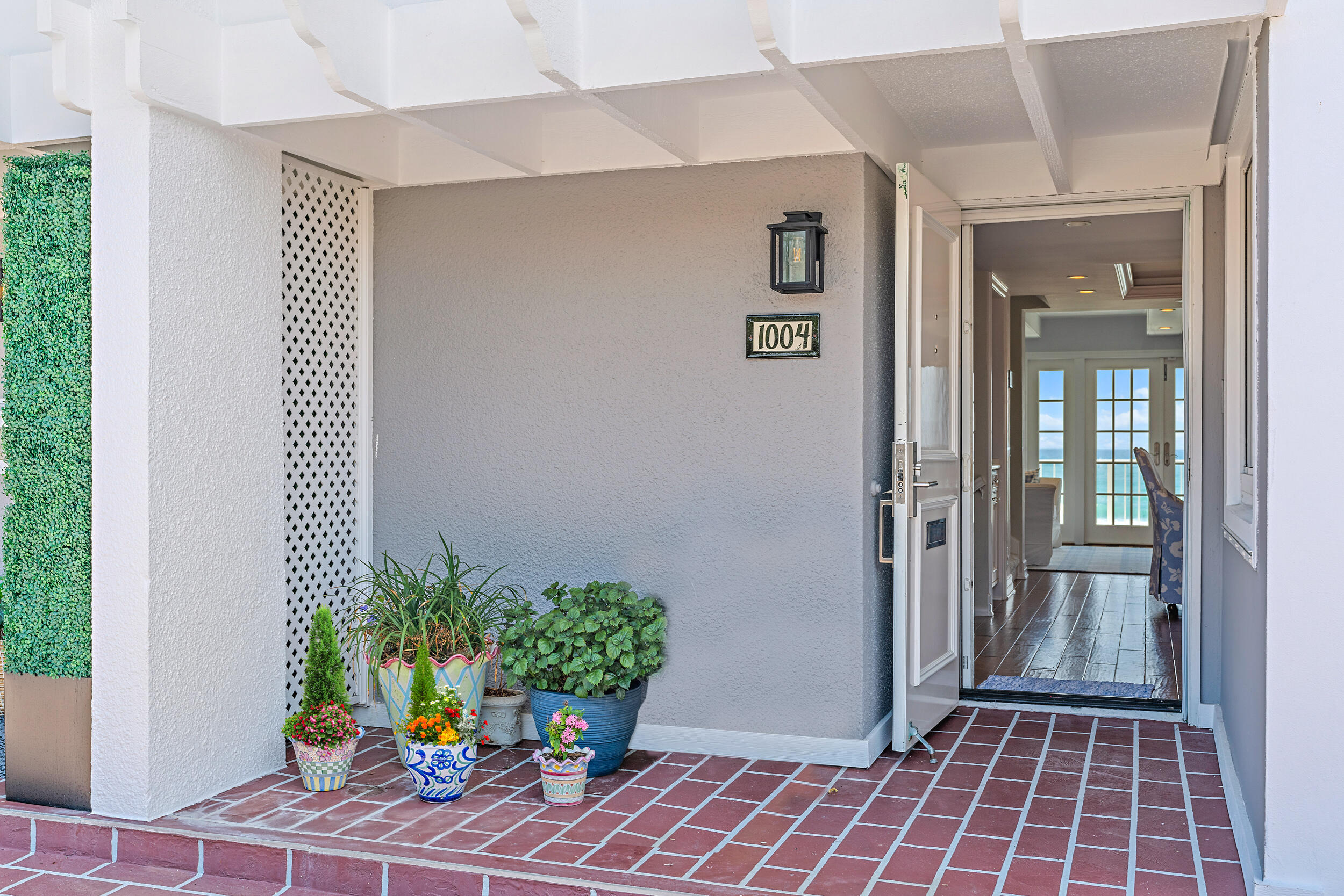 1004 Ocean Drive Juno Beach, FL 33408 - Photo 1 of 1 wooden floor with a potted plant