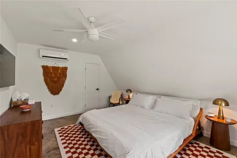a bedroom with a bed and cabinets