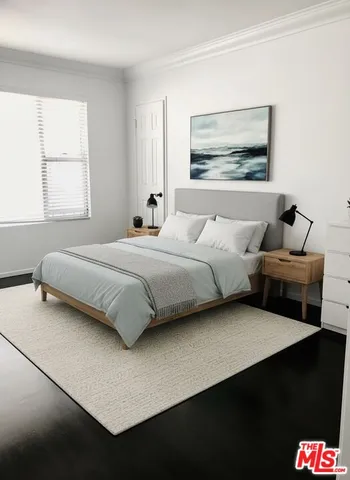 a view of room with window and wooden floor