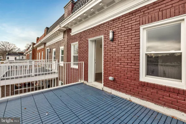 a view of a brick house with wooden floor