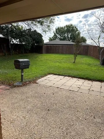 a view of a backyard with a garden