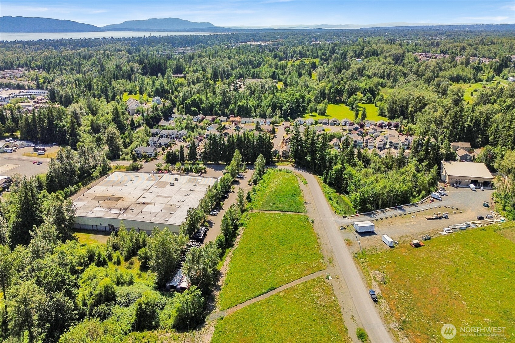 4122 Iron Gate Road Bellingham, WA 98226 - Photo 10 of 15 a view of a swimming pool with a yard and mountain view