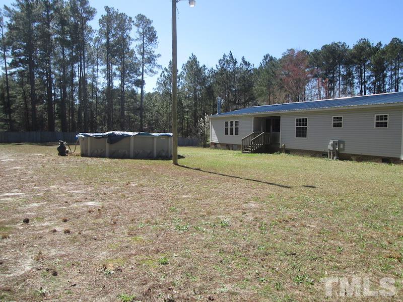 507 Line Road Cameron, NC 28326 - Photo 11 of 11 a view of a house with a yard