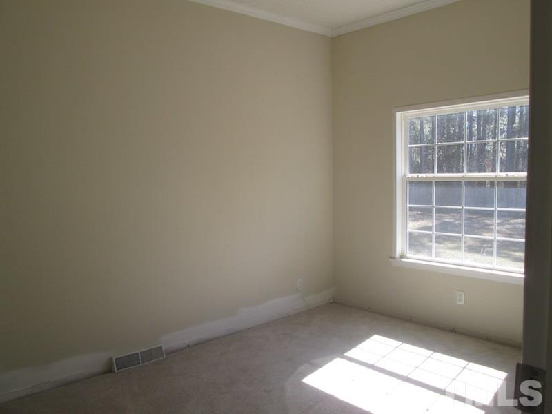 507 Line Road Cameron, NC 28326 - Photo 3 of 11 an empty room with a window