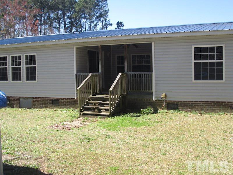 507 Line Road Cameron, NC 28326 - Photo 4 of 11 front view of a house with a yard