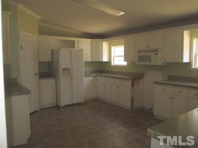 507 Line Road Cameron, NC 28326 - Photo 7 of 11 a view of a kitchen cabinets a sink a window and cabinets