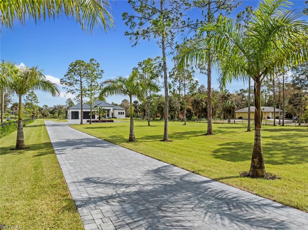 722 19th Street Southwest Naples, FL 34117 - Photo 7 of 47 View of property's community featuring a yard