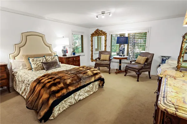 a bedroom with bed and window