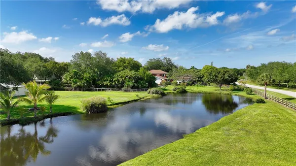a view of a lake with a yard