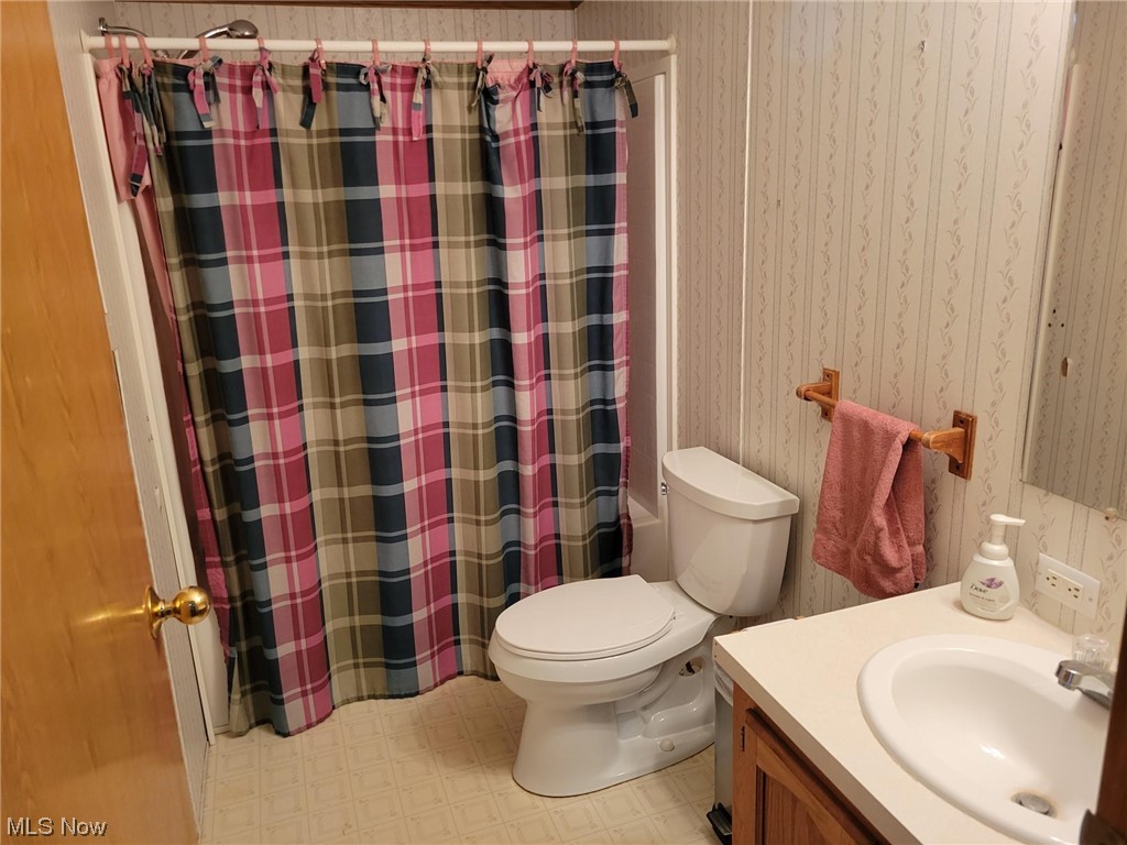 2450 Ferguson Road McConnelsville, OH 43756 - Photo 11 of 13 Bathroom with tile floors, toilet, and vanity
