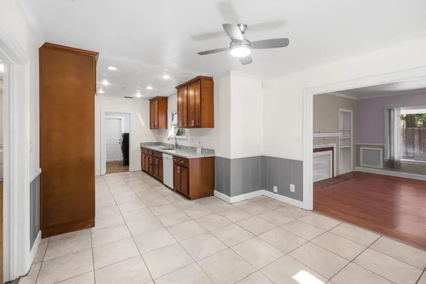 a large kitchen with stainless steel appliances granite countertop a stove and a sink