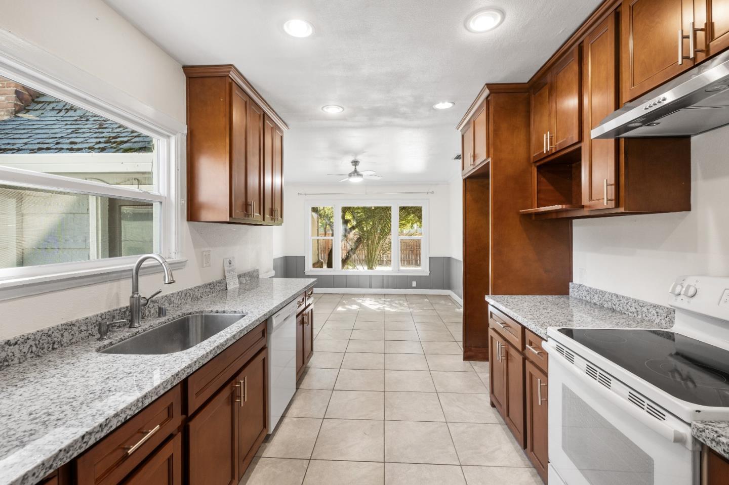 2905 Garfield Avenue Carmichael, CA 95608 - Photo 16 of 32 a kitchen with a sink stove top oven and cabinets