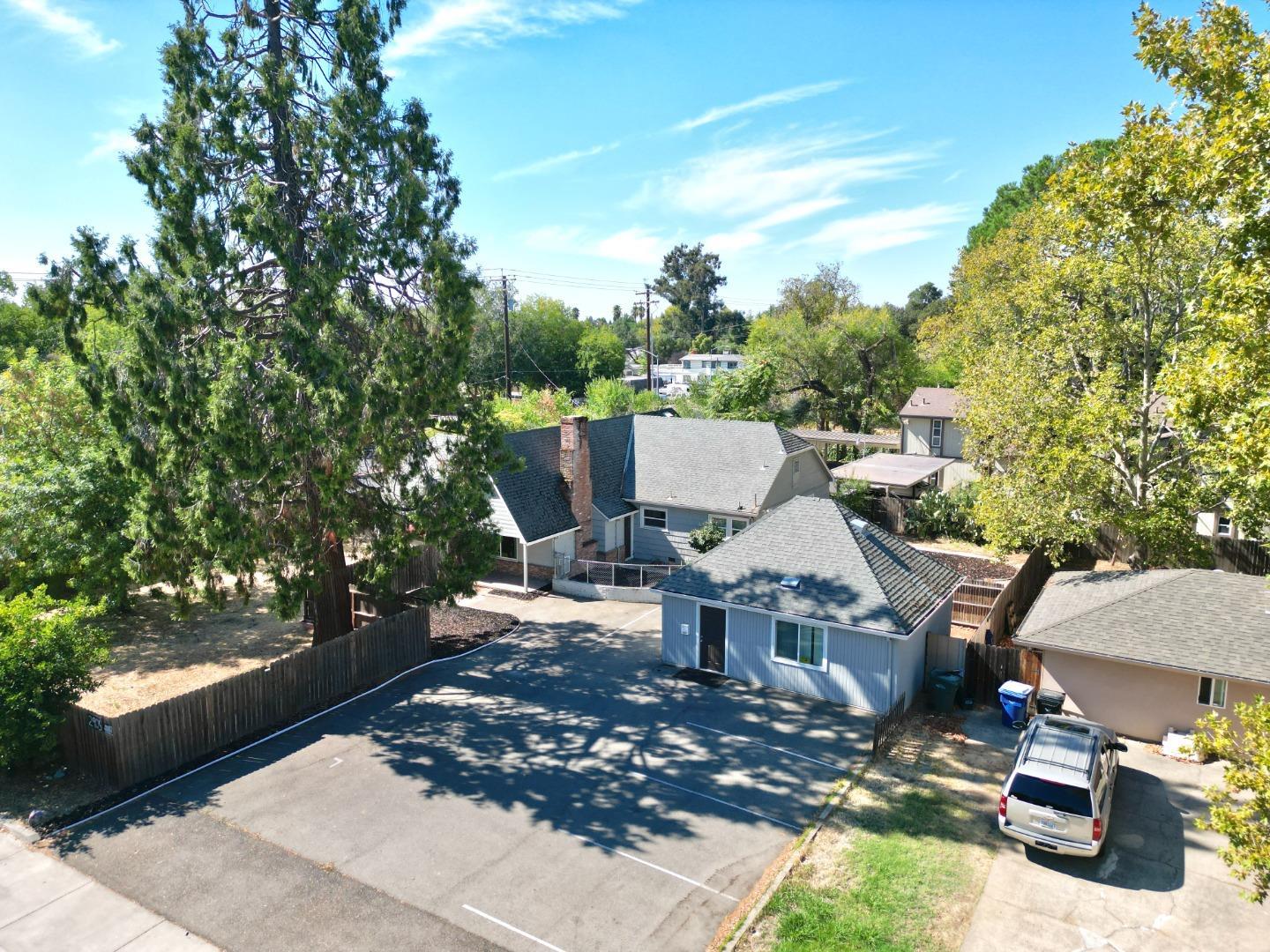 2905 Garfield Avenue Carmichael, CA 95608 - Photo 2 of 32 a view of a patio with table and chairs with wooden fence and plants