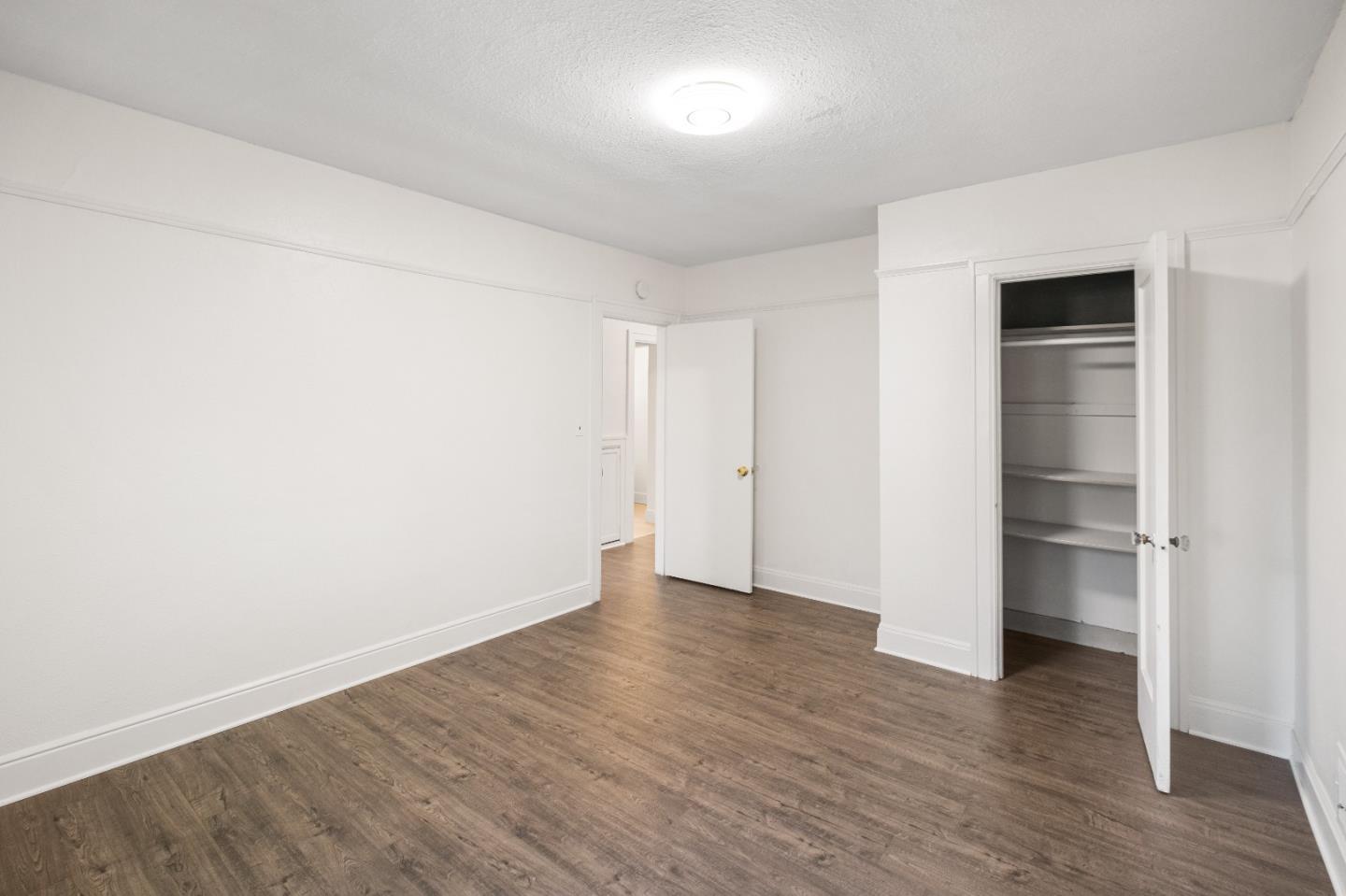 2905 Garfield Avenue Carmichael, CA 95608 - Photo 23 of 32 a view of an empty room with wooden floor & closet