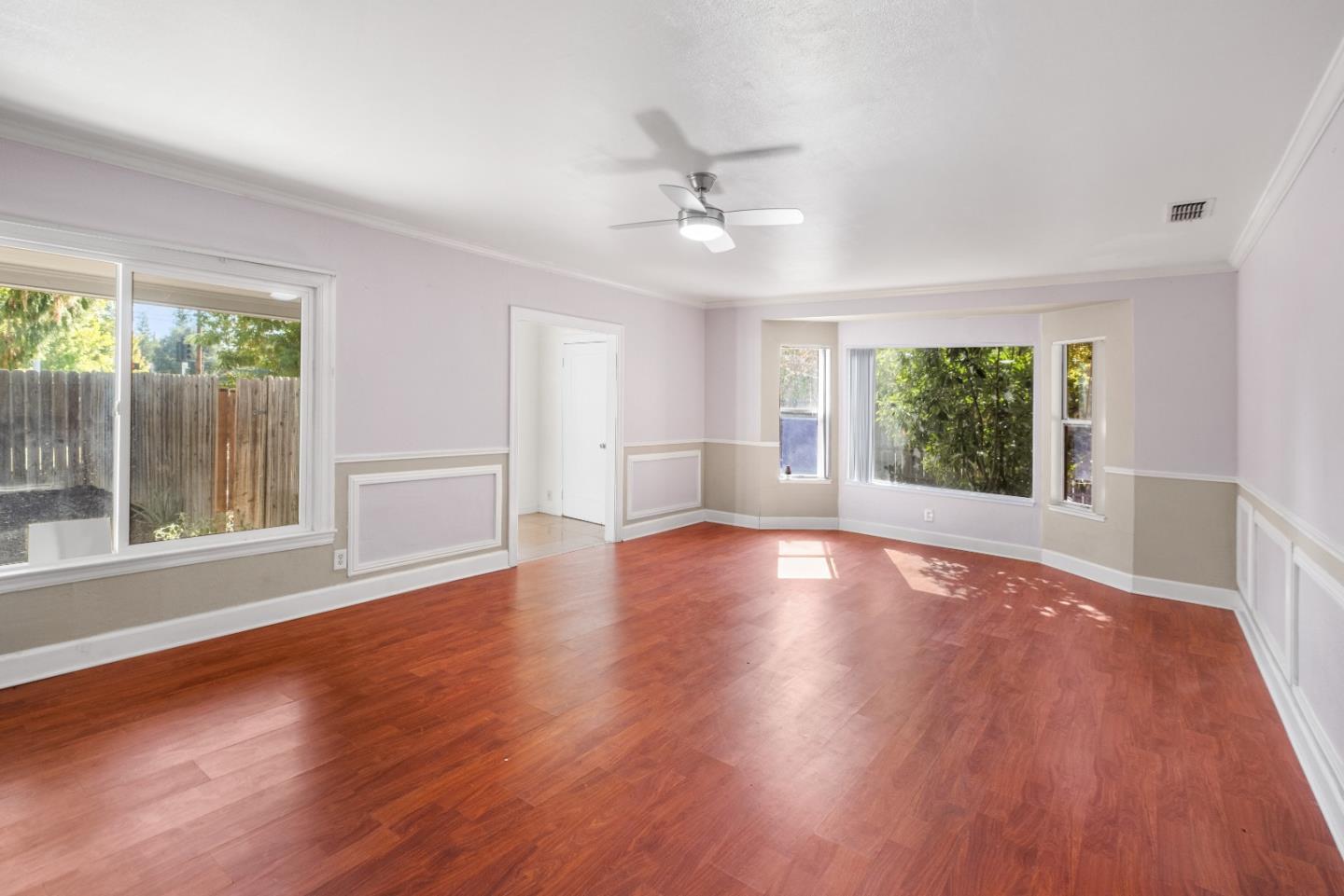 2905 Garfield Avenue Carmichael, CA 95608 - Photo 9 of 32 a view of empty room with wooden floor and fan