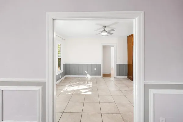 a view of a dining room with furniture window and outside view