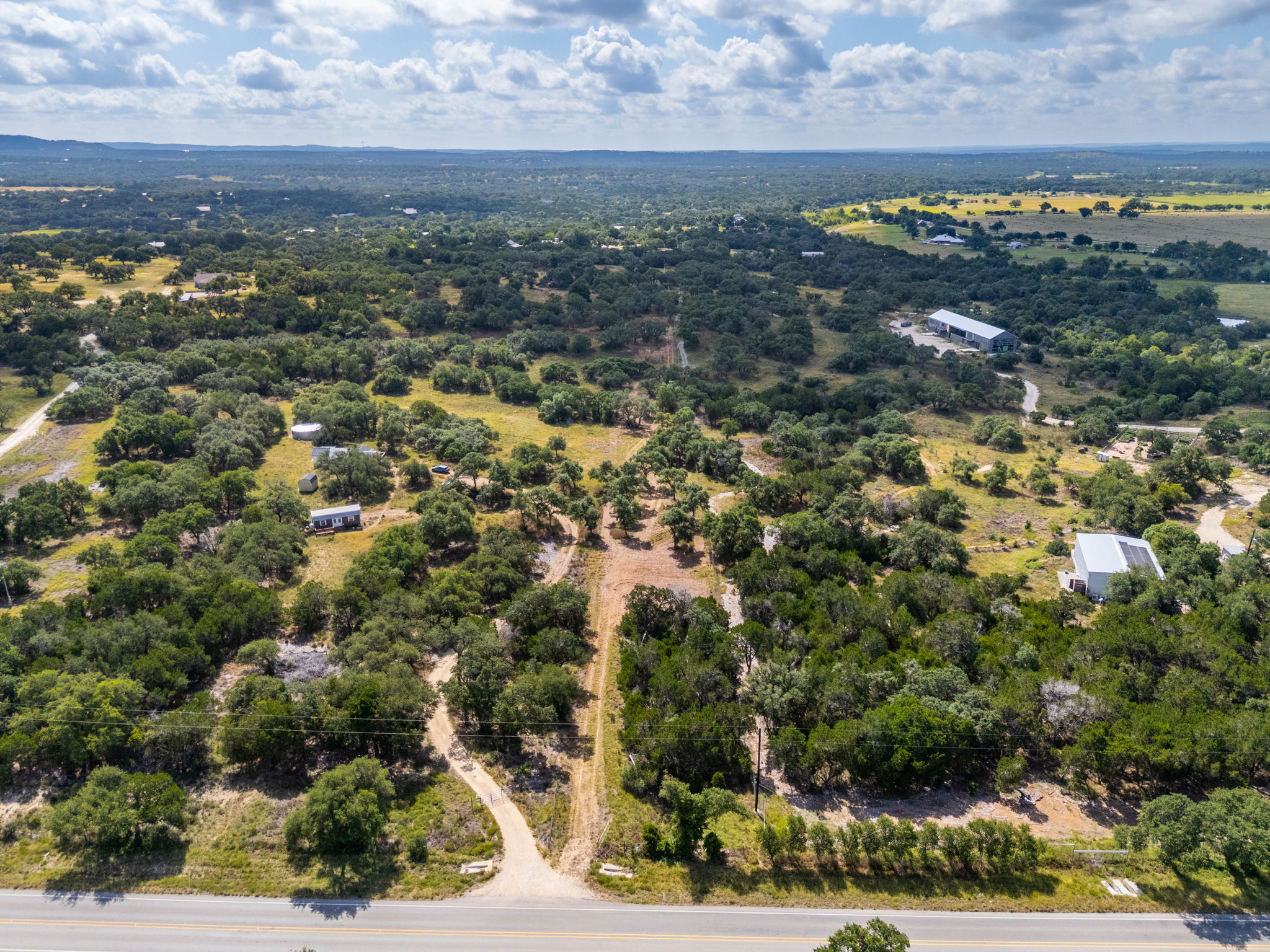 5385 Ranch Road 165 Blanco, TX 78606 - Photo 18 of 40 Vast natural landscape offers serene privacy and development potential amidst rolling hills and abundant trees.