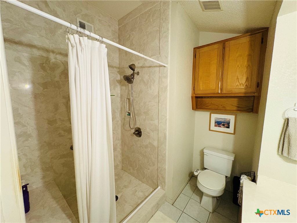 369 County Road 3367 Kempner, TX 76539 - Photo 11 of 18 a white toilet sitting next to a bathroom sink