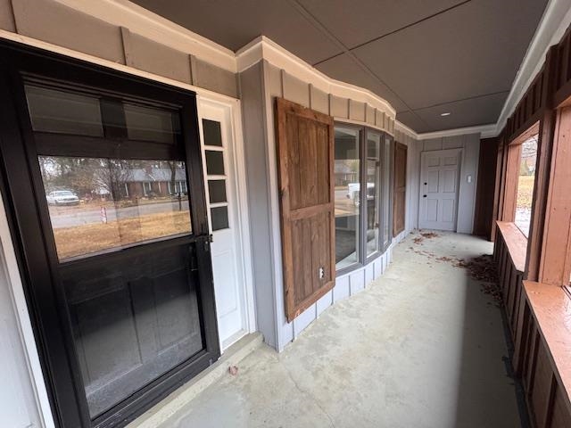 1519 Walters Street Covington, TN 38019 - Photo 15 of 15 a view of a hallway with wooden floor and a kitchen