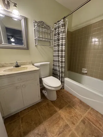 a bathroom with a toilet a sink and bathtub
