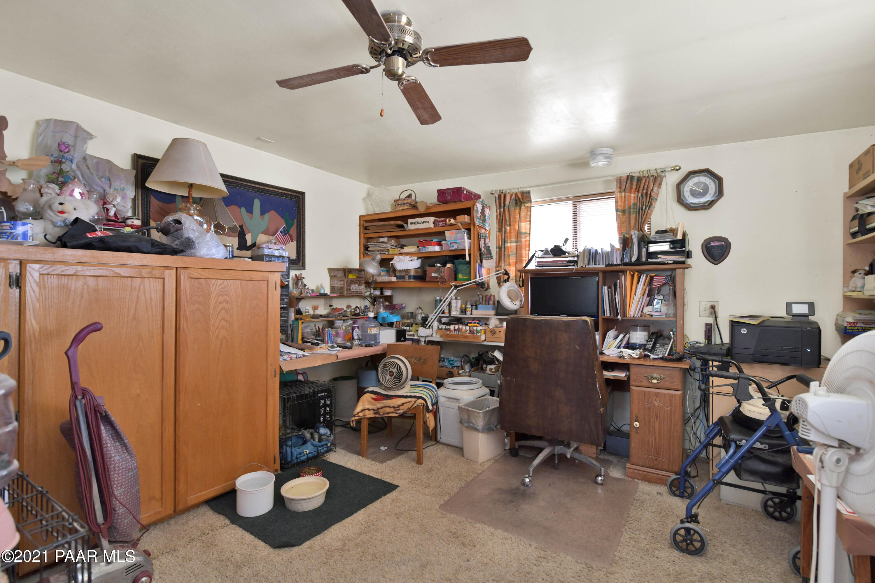 3250 North Reed Road Chino Valley, AZ 86323 - Photo 21 of 40 a view of a workspace with furniture and a window